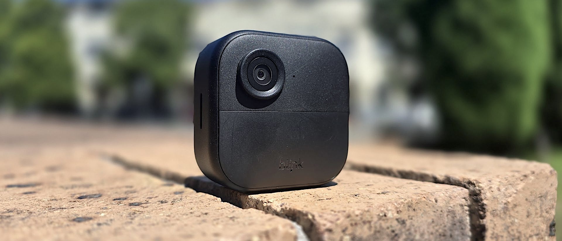 Blink Outdoor 4 wireless smart security camera mounted outside home