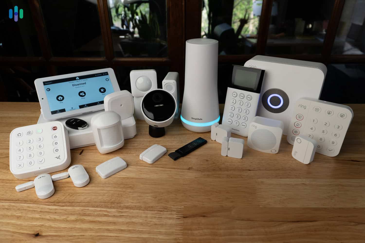 A DIY smart home setup with hub, smart bulbs, and sensors on a living room table. best DIY smart home system
