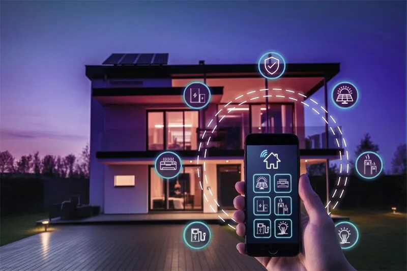 Installer mounting outdoor security camera and video doorbell on a home in Austin at dusk. Smart Home Security Installers Austin