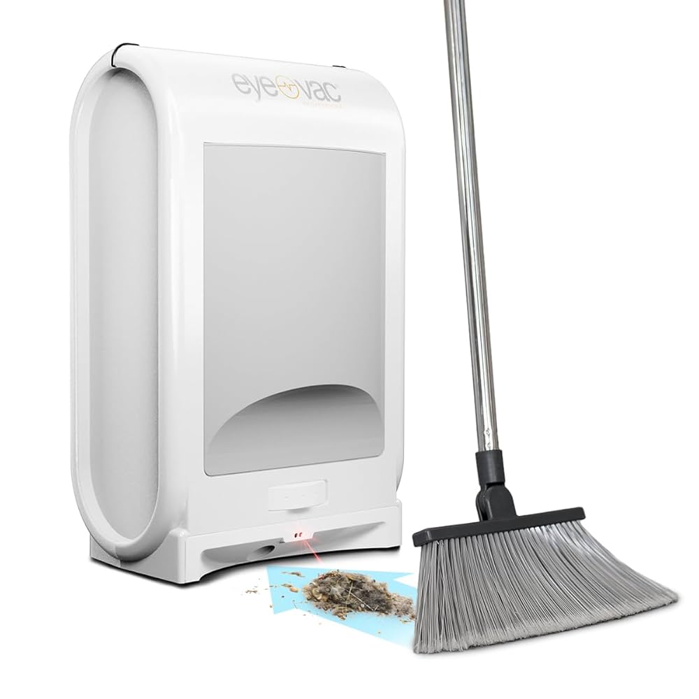 EyeVac Home Touchless Vacuum mounted under kitchen cabinet with hands sweeping debris.